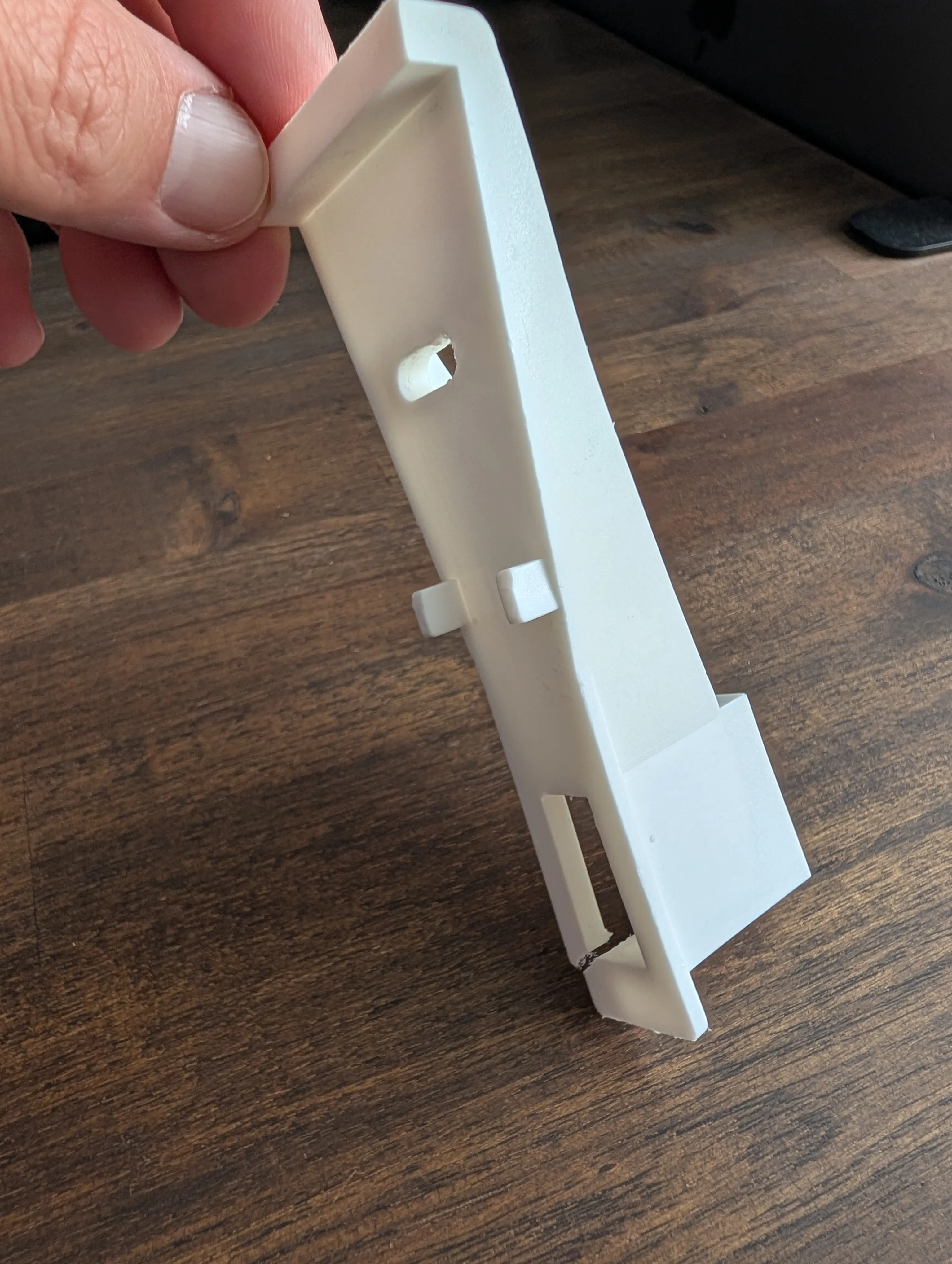 A 3D printed kitchen cabinet drawer pull bracket